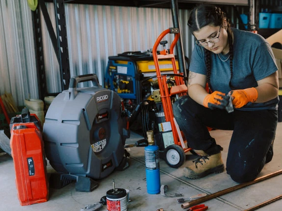 Woman is working on Plumbing Work