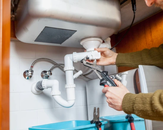 Man is Fixing Water Greaser