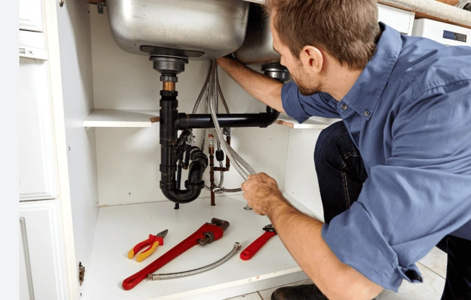 A man is Fixing Water Heater
